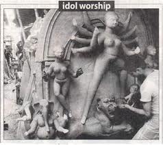 Idol Worship : This image, which has been pruriently photoshopped, appeared in the Deccan Chronicle, Chennai, some years ago on Durga Puja. Idol worship