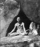 Fr. Henri Le Saux aka Abhishiktananda in a cave on Arunachala Hill. Note the Benedictine cross on his&nbsp;neck.
