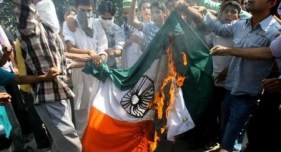 Kashmiri boys burning the Tiranga.