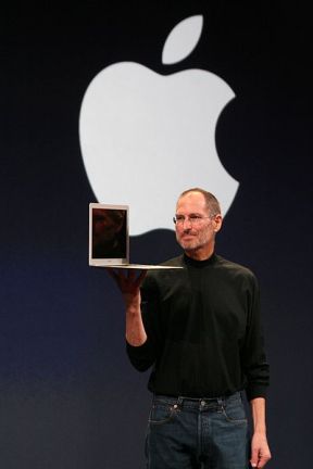 Steve Jobs showing off his MacBook Pro laptop computer.