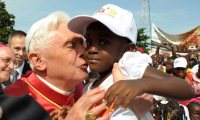Pope kissing boy: Look at the boy's expression! 