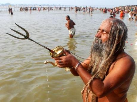Sadhu bathing at Sangam