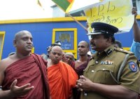 Srilankan monks and policeman.