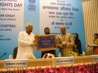 Fr. Ajay Kumar Singh receives award from UPA's Minority Commission.
