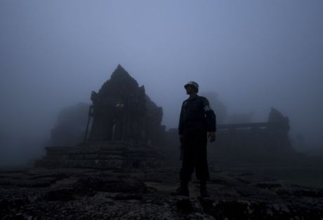 A Cambodian soldier stands guard on the grounds of the Preah Vihear Temple. A Cambodian soldier stands guard on the grounds of the Preah Vihear temple.