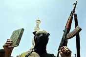 Jihadi with a Koran and AK 47