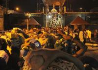Pilgrims wait to climb the 18 steps at Sabarimala