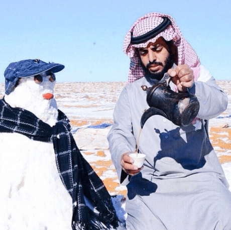 Saudi pouring tea for his Snow Friend! Saudi with Snow Man