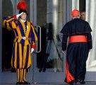 Swiss Guard saluting a Cardinal