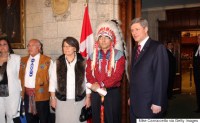  Canadian Prime Minister Stephen Harper (R) and National Chief of the Assembly of First Nations Phil Fontaine (2R) pause before walking into the House of Commons on Parliament Hill June 11, 2008 in Ottawa, Canada. Harper delivered a formal statement of apology on behalf of the Federal Government and all Canadians to former students of Indian Residential Schools, who for decades were forcibly removed from their communities and sent to state-funded schools to be assimilated. (Photo by Mike Carroccetto/Getty Images)