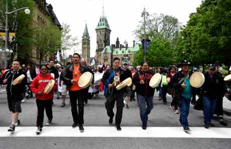 Drummers pass Parliament Hill as they lead the Walk for Reconciliation, part of the closing events of the Truth and Reconciliation Commission on Sunday, May 31, 2015 in Ottawa. Beginning in the 1870s, over 150,000 First Nations, Metis and Inuit children were required to attend government-funded, church-run residential schools in an attempt to assimilate them into Canadian society; the last school closed in 1996. Students were prohibited from speaking their own languages, practicing their culture and often experienced physical and sexual abuse. THE CANADIAN PRESS/Justin Tang