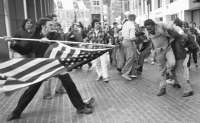 Roxbury, Boston 1974: Black student about to be stabbed with US flag pole.