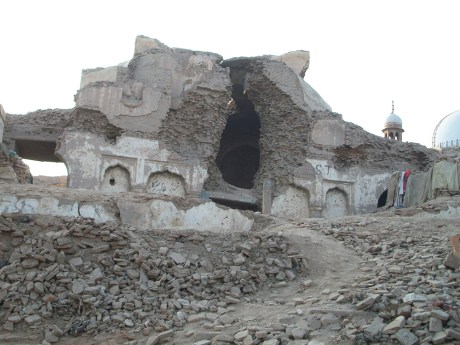 Desecrated Bhagat Prahlad Temple and Shah Rukn-e-Alam Shrine (background), Multan, Pakistan. Photo (C) Alie Imran