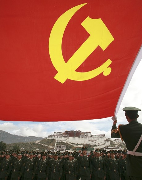 Policemen review the oath that they took when they joined the Communist Party of China (CPC) in front of Potala Palace in Lhasa