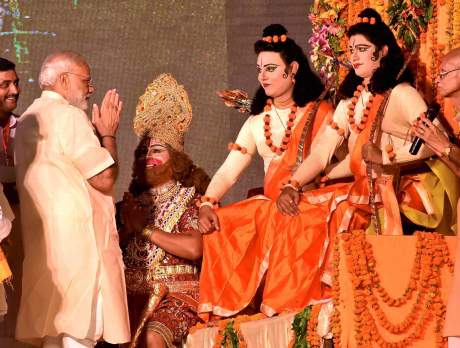 PM Narendra Modi worships artists enacting Lords Rama, Lakshman and Hanuman during Dussehra celebrations at Aishbagh Ram Leela in Lucknow (2017). Narendra Modi