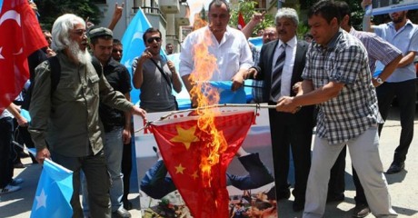 Uighurs living in Turkey burn a Chinese flag 