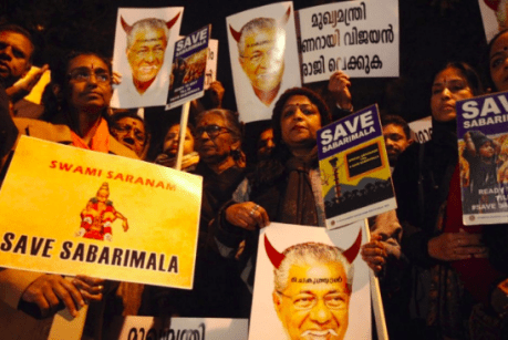 Sabarimala devotees demonstrate against Kerala CM Vijayan's attempts to desecrate the Sabatimala shrine. Sabarimala devotees demonstrate against Comrade Pinarayi