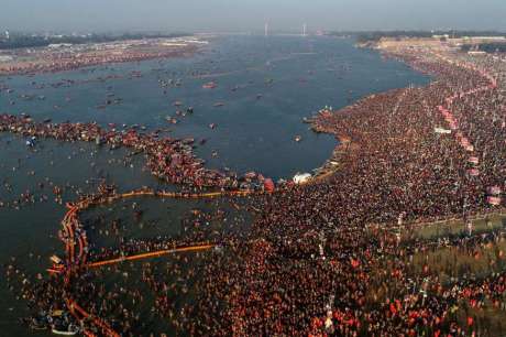 Sadhus and devotees take bath at Sangam (2019)
