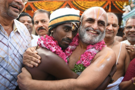 Chilkur Balaji priest carries a Dalit youth on his shoulders to the temple. Chilkur Balaji Temple priest carries a Dalit youth on his shoulders (2021).