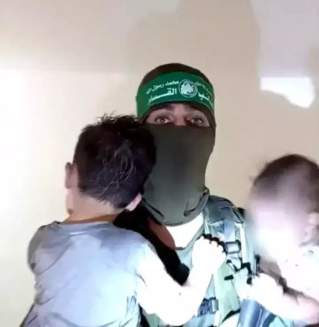 Hamas terrorist with hostage children.