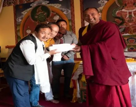 Buddhist monk contributes to the construction of the Ram Temple.