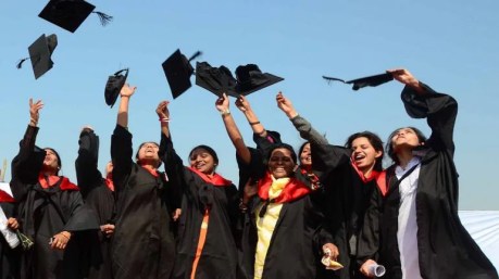 Indian students in medieval European robes and caps during a convocation. Indian students in medieval European academic robes and caps during a convocation.