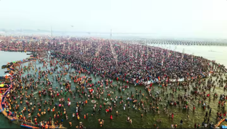 Pilgrims bathing in the Triveni Sangam.