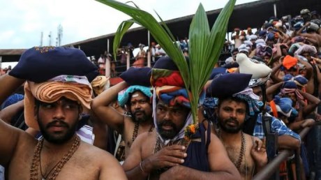 Devotees wait for Lord Ayyappa's darshan at Sabarimala. Devotees at Sabarimala.