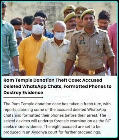 Police with two of the alleged donation thieves. Police with donation-theft accused.