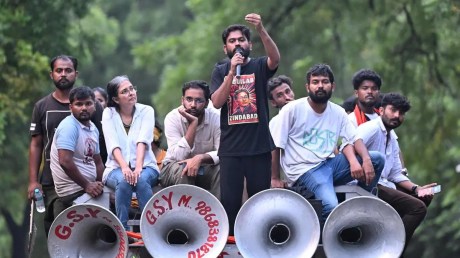 Cockroach Janta Party founder Abhijeet Dipke addresses protesters marching towards Parliament, seeking the resignation of Education Minister Dharmendra Pradhan, among other demands, in New Delhi, on July 20.